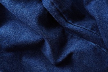 Denim. Kot pantolon arka planı. Kot pantolon desenli ya da kot pantolonlu. Mavi kot desenli..