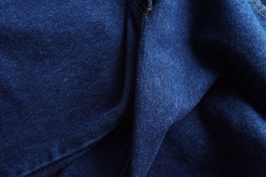 Denim. Kot pantolon arka planı. Kot pantolon desenli ya da kot pantolonlu. Mavi kot desenli..