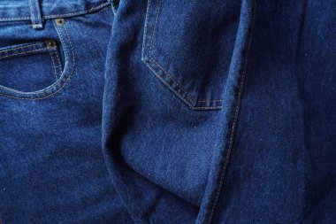 Denim. Kot pantolon arka planı. Kot pantolon desenli ya da kot pantolonlu. Mavi kot desenli..