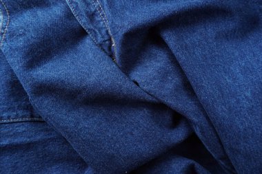 Denim. Kot pantolon arka planı. Kot pantolon desenli ya da kot pantolonlu. Mavi kot desenli..