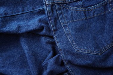 Denim. Kot pantolon arka planı. Kot pantolon desenli ya da kot pantolonlu. Mavi kot desenli..