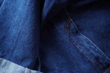Denim. Kot pantolon arka planı. Kot pantolon desenli ya da kot pantolonlu. Mavi kot desenli..