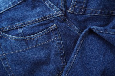 Denim. Kot pantolon arka planı. Kot pantolon desenli ya da kot pantolonlu. Mavi kot desenli..
