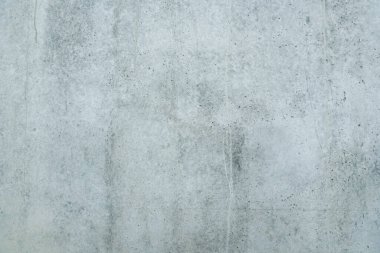 Arka plan ya da duvar kağıdı olarak pürüzsüz gri beton duvar dokusu. Sert desenli beton duvarı kapatın. Çimento dokusu.