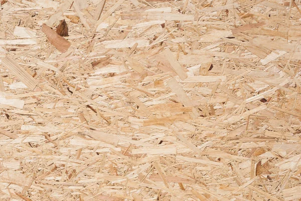 Osbボードは 木製の背景にサンド茶色の木のチップで作られています Osb木のベニヤの背景 タイト シームレスな表面のトップビュー ストランド ボード フレークボード スターリングボード アスペナイト — ストック写真