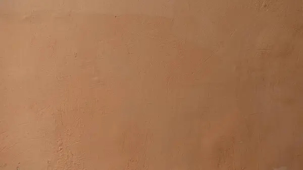 Arka plan doku için sarı beton duvar.