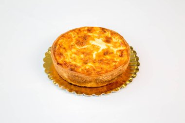 quiche with cheese on a gold tray with white background