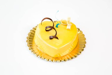 beautiful heart shaped cake cake on a gold tray on white background for valentine