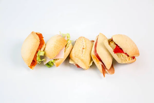 small sandwiches on white background