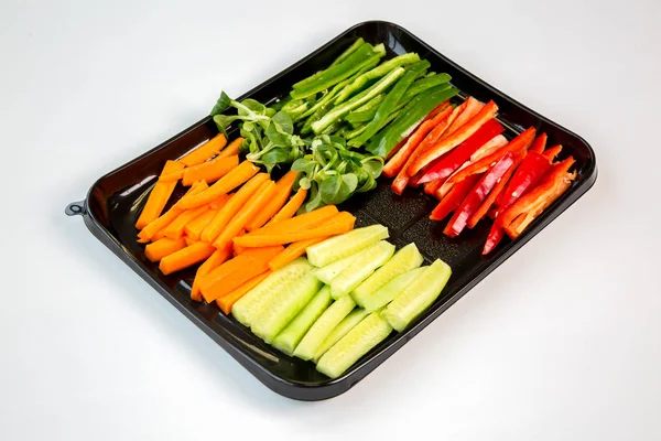 Raw Vegetables Cut Strips Black Tray Prepared Takeaway White Background — Stock Photo, Image