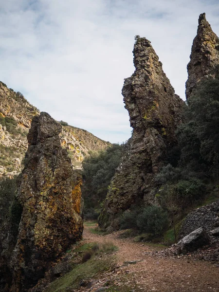 natural path up the mountain with cliffs on the sides