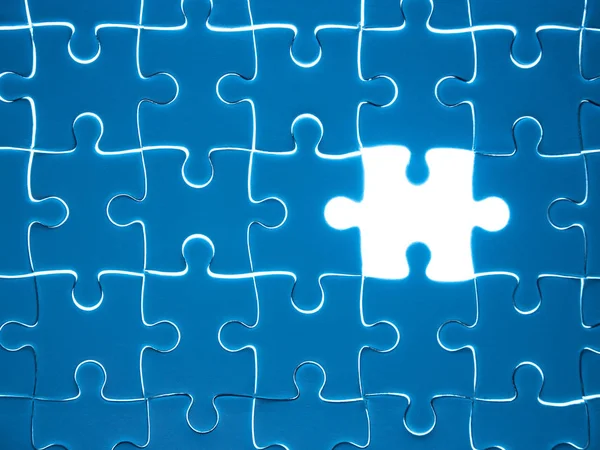 Missing Jigsaw puzzle piece with lighting, business concept for completing the finishing puzzle piece.