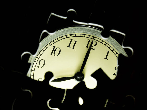 Missing jigsaw puzzle pieces on Alarm clock background, Business solution concept, Time for success concept.