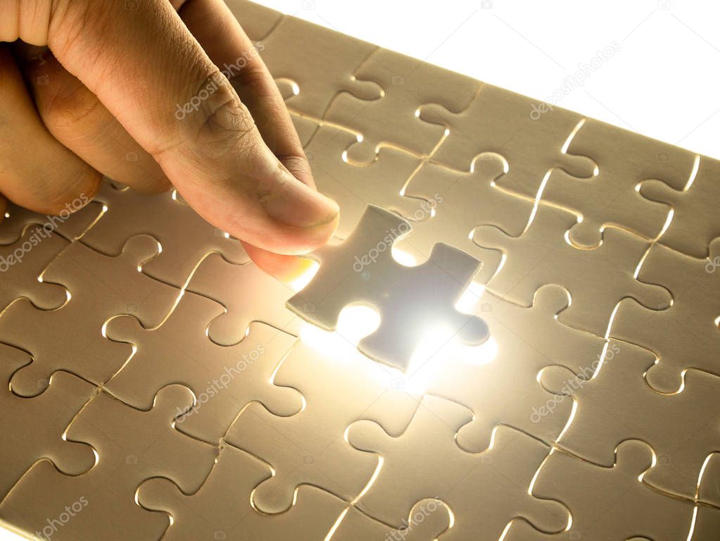Missing Jigsaw puzzle piece with lighting, business concept for completing the finishing puzzle piece.