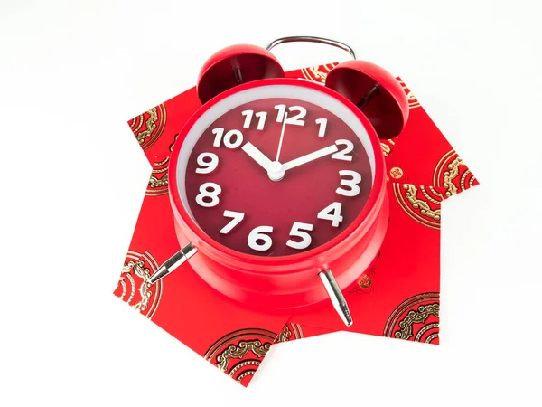 Red envelope isolated on white background with Red alarm clock for gift Chinese New Year. Chinese text on envelope meaning Happy Chinese New Year.