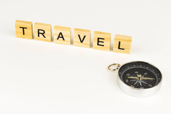Travel Word In Wooden Cube with compass.