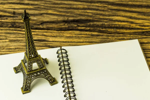 Open Book Eiffel Tower Replica Wooden Background — Stock Photo, Image