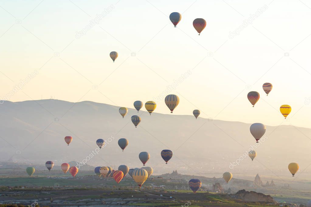 Colorful Hot air balloon flying over Red valley at Cappadocia, A