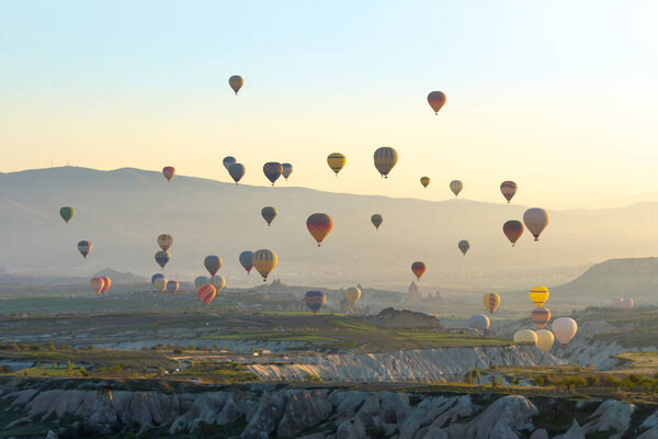 Colorful Hot air balloon flying over Red valley at Cappadocia