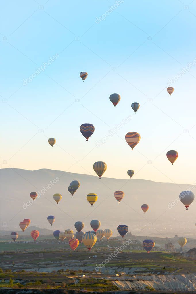 Colorful Hot air balloon flying over Red valley at Cappadocia
