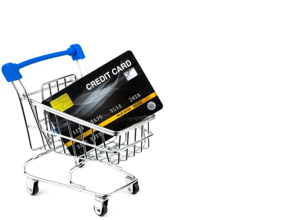 Credit cards in kleine winkelwagen geïsoleerd op witte achtergrond — Stockfoto