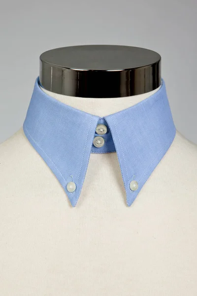 A blue shirt collar on the manikin