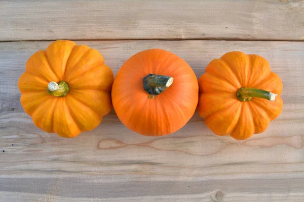 Three Pumpkins Wooden Background — Stock Photo, Image