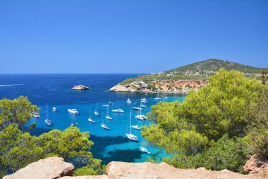 Cala d'Hort bay with turquoise water on Ibiza island, Spain. Scenic view. clipart