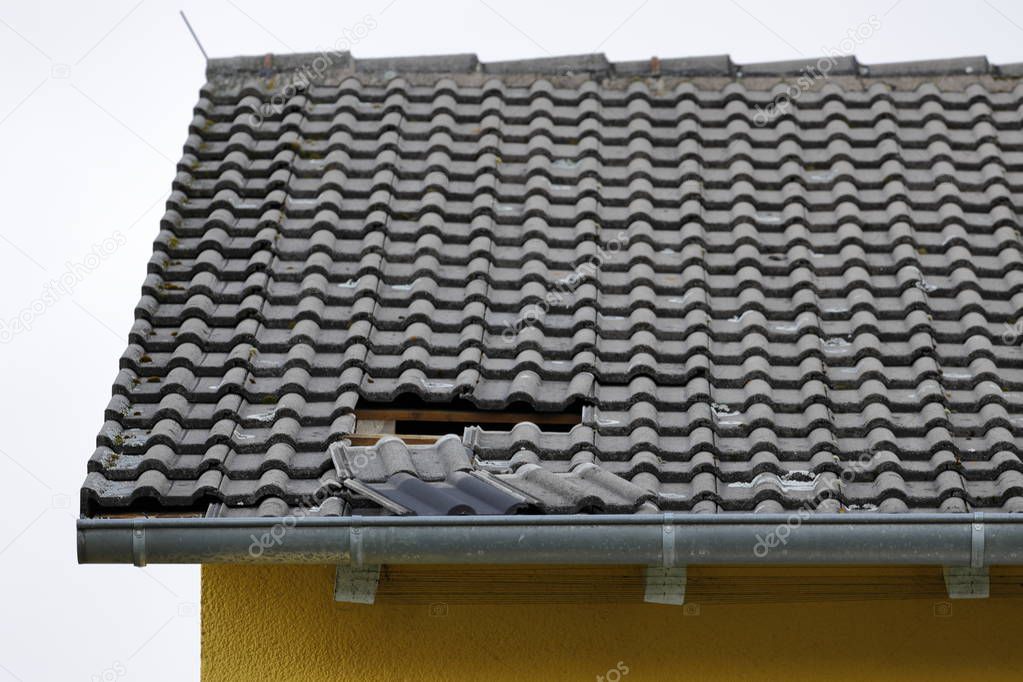 Hole in the roof by wind and storm