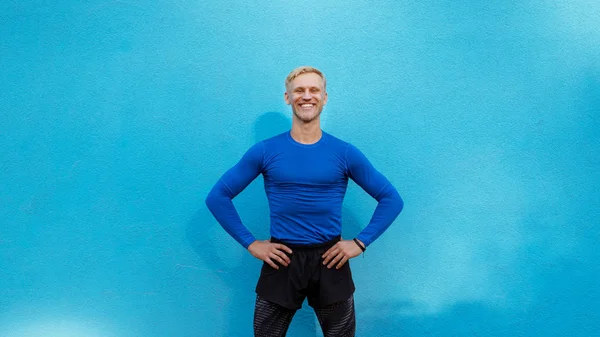 a guy in a blue sports sweater