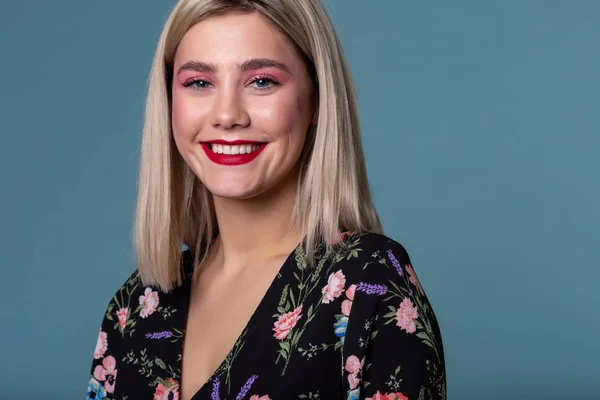 Cheerful happy young beautiful woman looking at camera