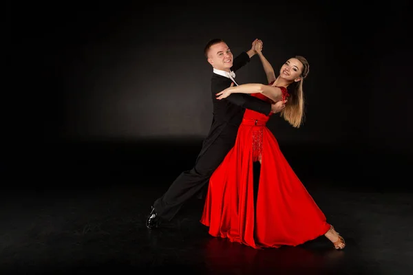 Sensual professional young dancers dancing tango in studio
