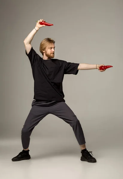 Karate man in black shirt and pants posing — Stock Photo, Image
