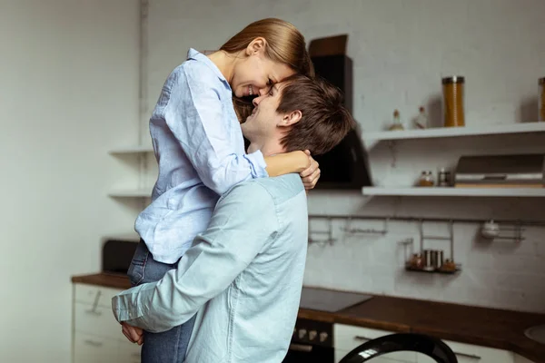 Romantic young couple in love spending time together in kitchen — Stock Photo, Image