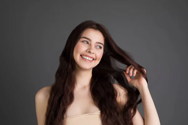 Young cheerful carefree joyful brunette female laughs happily with pleasure — Stock Photo, Image