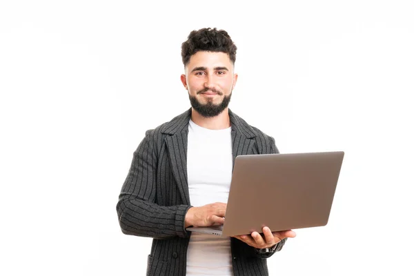 Pleasant positive business man using laptop, isolated over white background — Stock Photo, Image