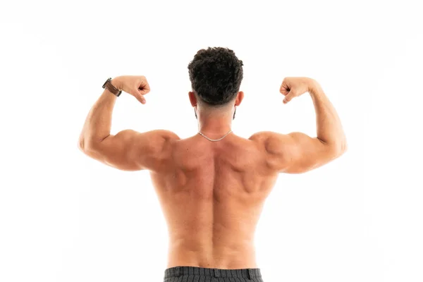 Starker athletischer Mann - Fitness-Model zeigt seinen perfekten Rücken isoliert auf Weiß — Stockfoto