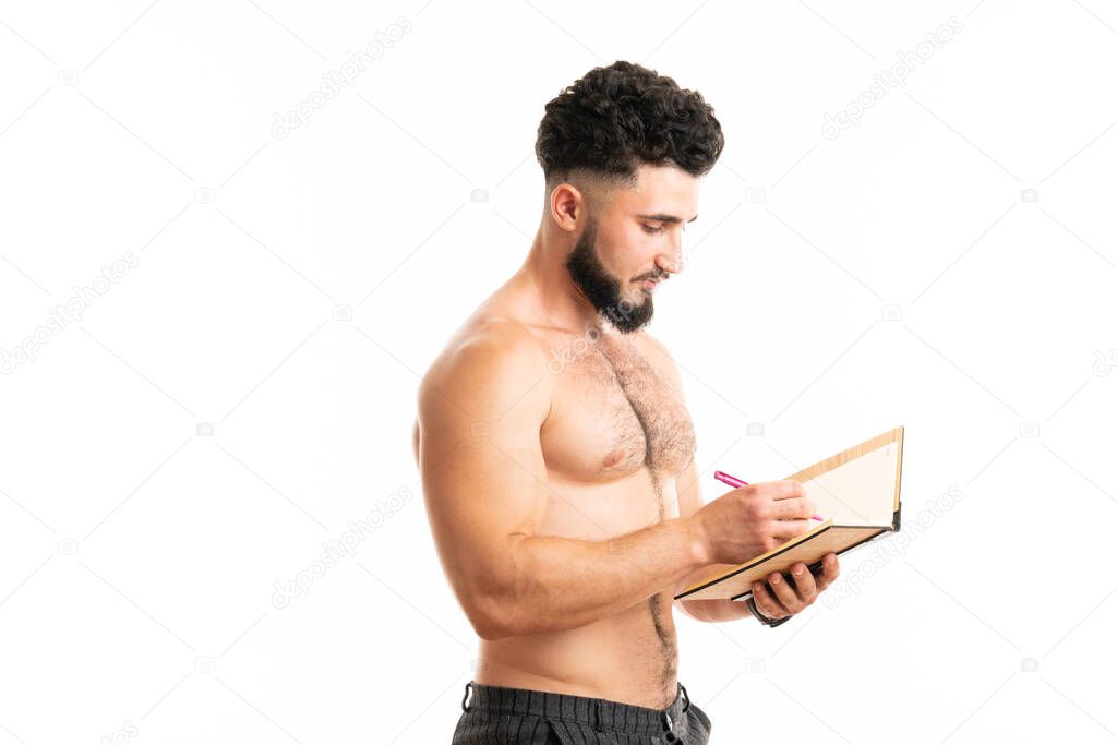 Writing master. University student do writing task isolated on white. Handsome man write in copybook