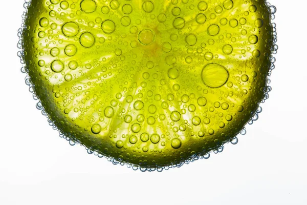 Air Bubbles Cover Slice Juicy Lime Floating Water — Stock Photo, Image