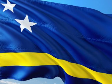 Curacao derin mavi gökyüzü karşı rüzgarda sallayarak bayrak. Yüksek kaliteli kumaş.