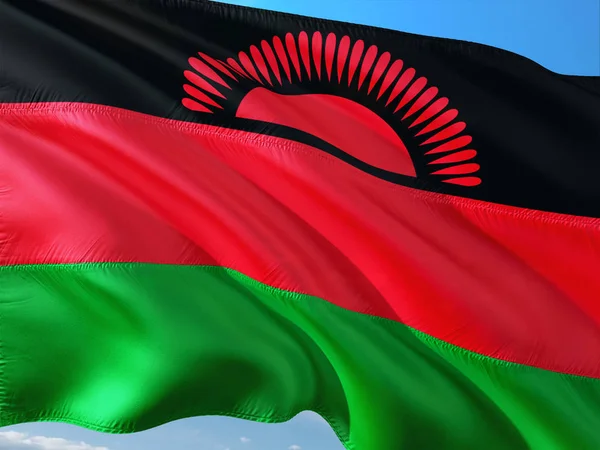 Malavi derin mavi gökyüzü karşı rüzgarda sallayarak bayrak. Yüksek kaliteli kumaş.