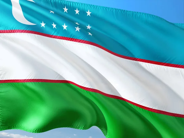 Bandera Uzbekistán Ondeando Viento Contra Cielo Azul Profundo Tejido Alta —  Fotos de Stock