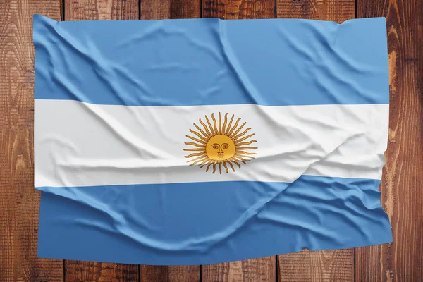 Flagge Argentiniens Auf Einem Holztischhintergrund Zerknitterte Argentinische Flagge Von Oben — Stockfoto