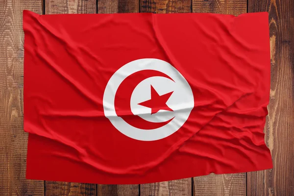 Tunisien Flagga Träbord Bakgrund Skrynkliga Tunisiska Flaggan Ovanifrån — Stockfoto