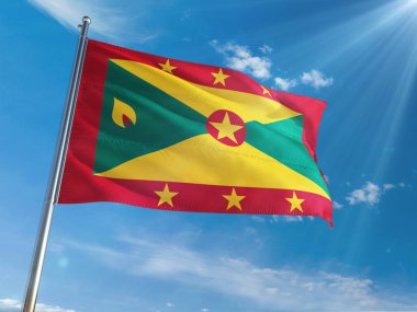 Grenada bayrağı Ulusal sallayarak güneşli mavi gökyüzü arka plan karşı kutup. Yüksek çözünürlüklü