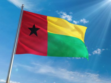 Gine Bissau ulusal bayrak sallayarak güneşli mavi gökyüzü arka plan karşı kutup. Yüksek çözünürlüklü