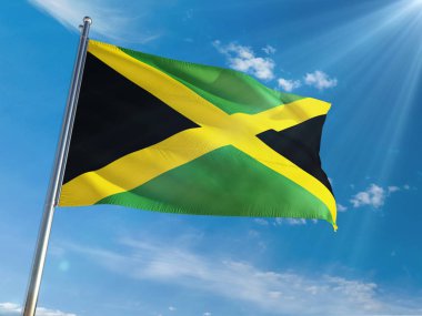 Jamaika bayrağını Ulusal sallayarak güneşli mavi gökyüzü arka plan karşı kutup. Yüksek çözünürlüklü