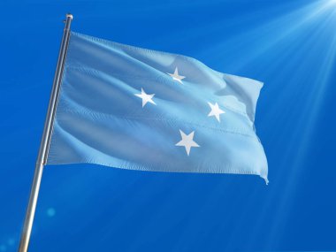 Micronesia National Flag Waving on pole against deep blue sky background. High Definition clipart