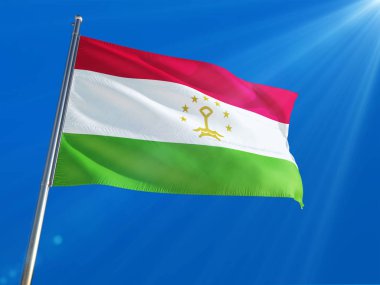 Tacikistan bayrağı Ulusal sallayarak derin mavi gökyüzü arka plan karşı kutup. Yüksek çözünürlüklü