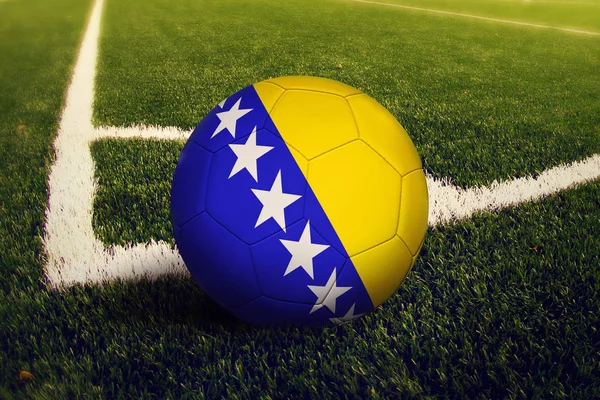 Bosnia Herzegovina ball on corner kick position, soccer field background. National football theme on green grass.